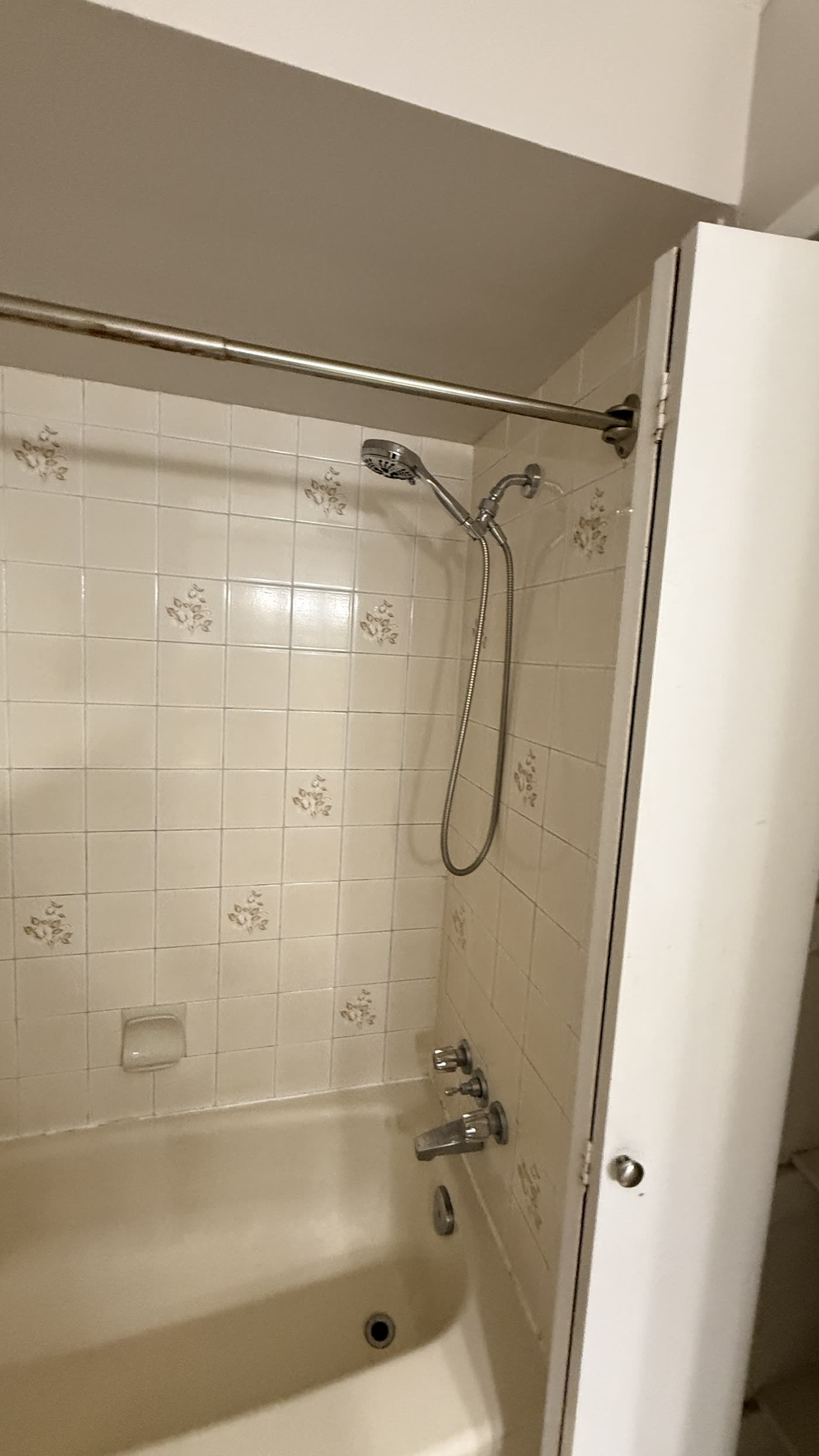 Original tiled bathtub before renovation in Burnaby
