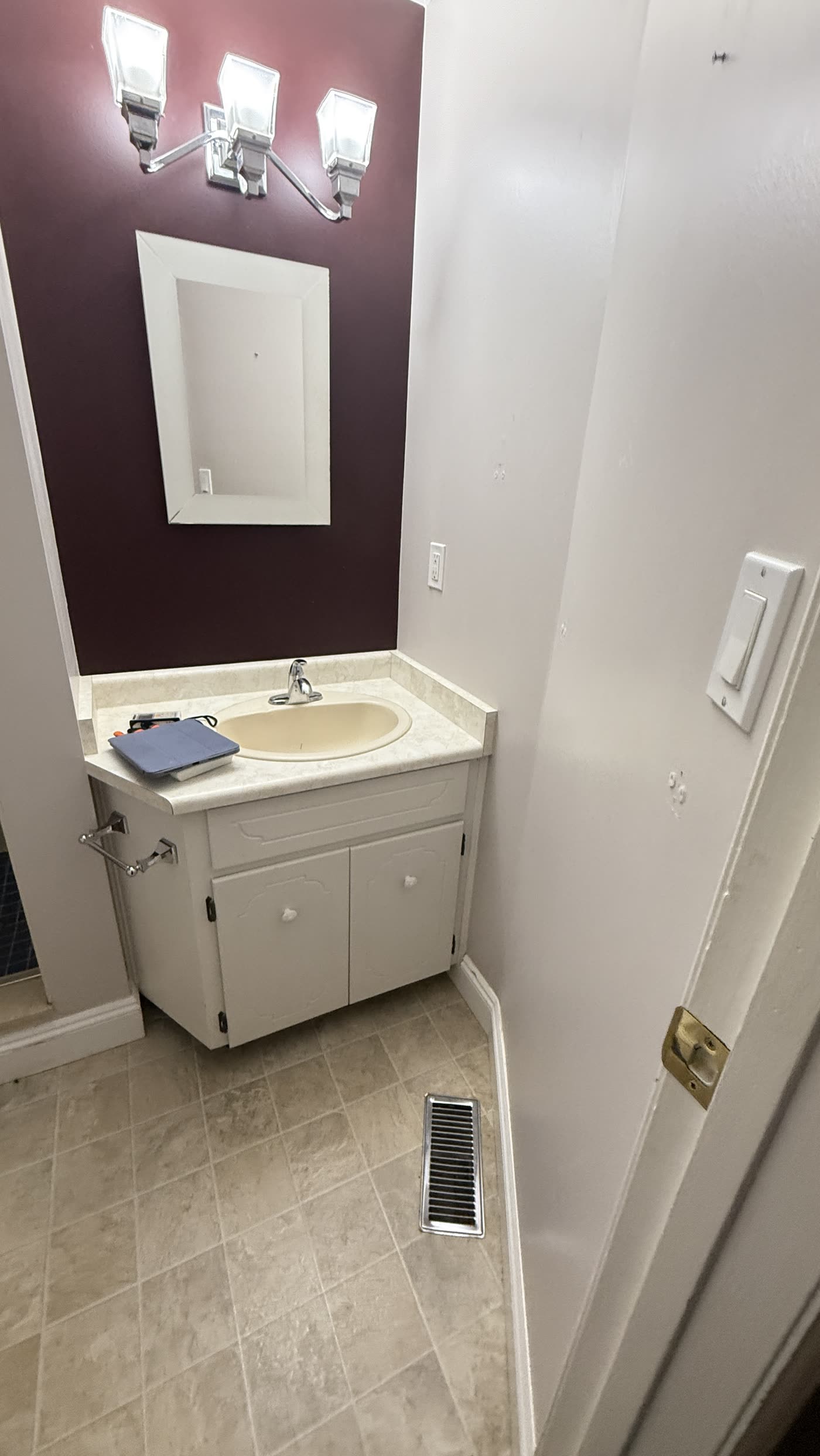 Original small vanity before renovation in Burnaby