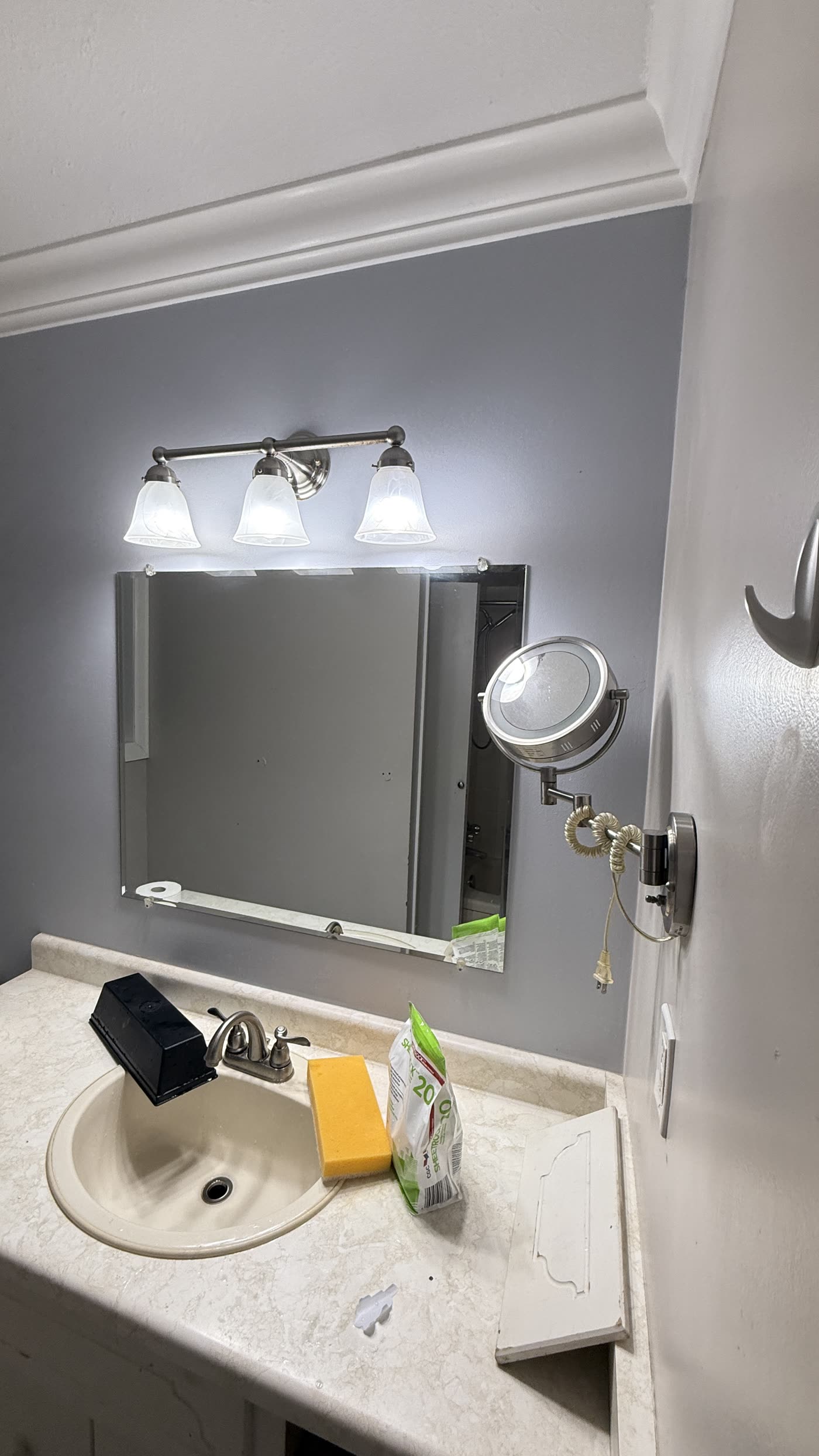 Original vanity and mirror before Burnaby bathroom renovation